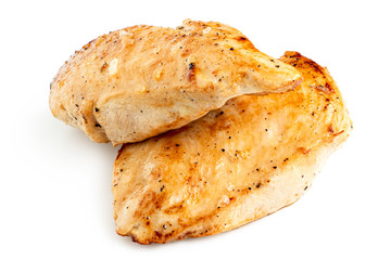 Two whole pan roasted chicken breasts isolated on white.