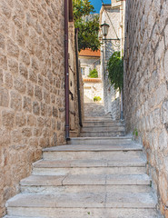 Fototapeta na wymiar Narrow street in the old town of Perast, Montenegro