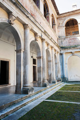 Courtyard with colonnade inside the charterhouse of Padula, Salerno, Italy