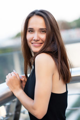 Young pretty likable cheerful woman posing summer city outdoor in Kyiv, Ukraine. Beautiful...