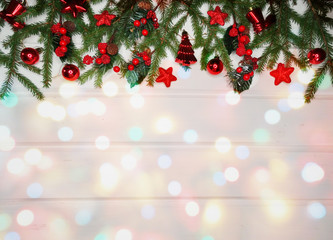 christmas decoration and garland lights on white wooden background