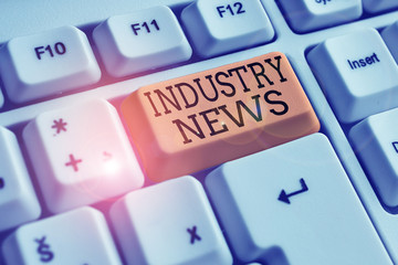 Conceptual hand writing showing Industry News. Concept meaning Technical Market Report Manufacturing Trade Builder White pc keyboard with note paper above the white background