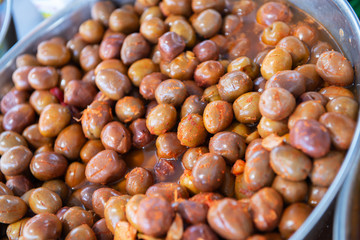 Salting olives sold on outdoor spanish market. Food