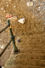 Sand stairs leading to the sea. Close up