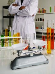 scientist in laboratory with test tubes