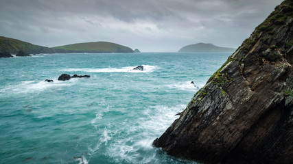 dunquin harbour in the dingle pensinsula in the south west coast of ireland during sunset on an...