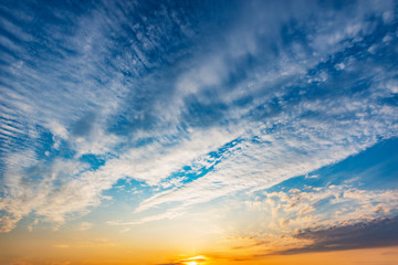 Colorful clouds after rain at sunset time.