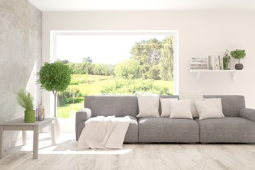 Stylish room in white color with sofa and summer landscape in window. Scandinavian interior design. 3D illustration