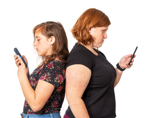 Mother and Daughter Back-To-Back Looking At Phones