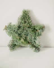 Overhead view of Christmas decoration being made. Christmas wreath weaving workshop. spruce branches, cones and various organic decorations on the table