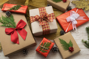 Fototapeta premium gift boxes with bows and ribbons on a wooden background