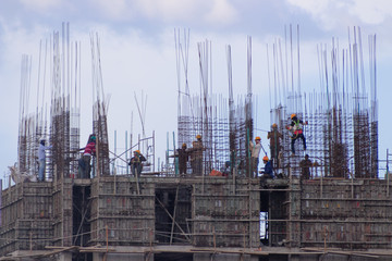 workers on construction building higness