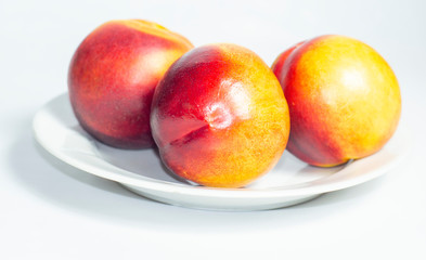 Fototapeta na wymiar ripe peaches on a white background. 