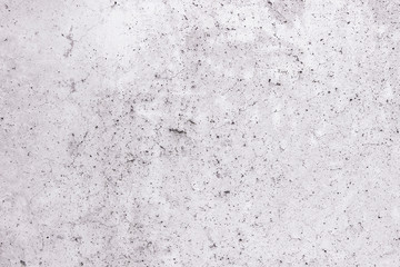 Light gray concrete wall texture with cracks and holes as background.