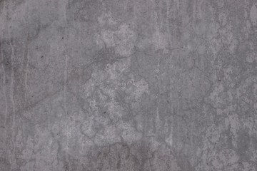 cracked gray concrete wall texture as background.