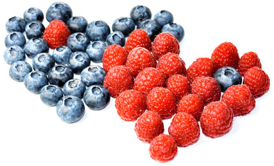 raspberries and blueberries on white background