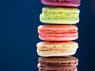 rench colorful macarons on blue background