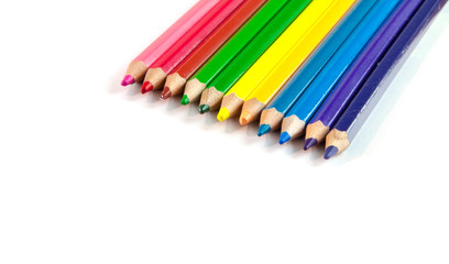 Colorful row of pencils isolated on white background with copyspace for advertising text