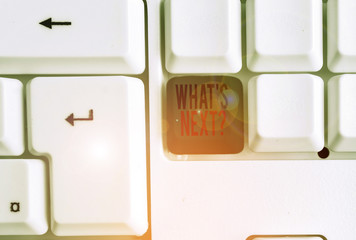 Text sign showing What S Next Question. Business photo text asking demonstrating about his coming actions or behaviors White pc keyboard with empty note paper above white background key copy space