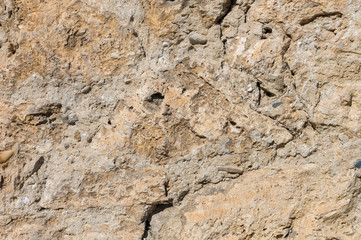 Ancient stone building mix of the exposed facade of the building during restoration. Grunge Abstract Background