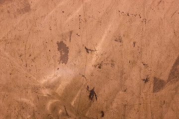 Empty scratched gold texture. Design background.