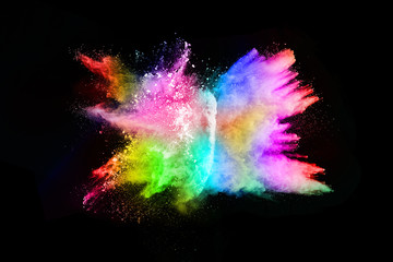 abstract colored dust explosion on a black background.abstract powder splatted background,Freeze motion of color powder exploding/throwing color powder, multicolored glitter texture.