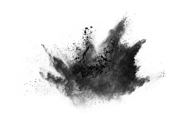 Closeup of black dust particles explode isolated on white background..