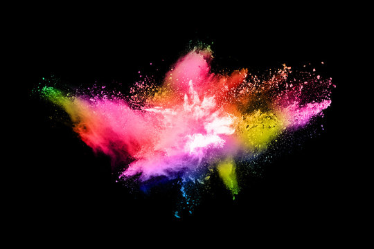 abstract colored dust explosion on a black background.abstract powder splatted background,Freeze motion of color powder exploding/throwing color powder, multicolored glitter texture. © kitsana