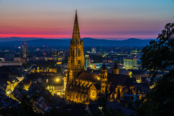 Germany, Romantic red sunset sky over beautiful black forest city freiburg in breisgau in baden...