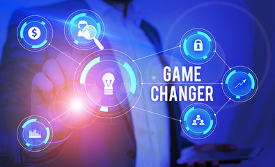 Word writing text Game Changer. Business photo showcasing Sports Data Scorekeeper Gamestreams Live Scores Team Admins Male human wear formal work suit presenting presentation using smart device