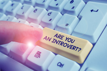 Writing note showing Are You An Introvertquestion. Business concept for demonstrating who tends to...