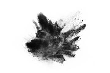 Fototapeta na wymiar Closeup of black dust particles explode isolated on white background..