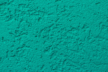 texture of beautiful turquoise decorative plaster background or concrete paint wall , abstract grain stucco backgroung for wallpaper design