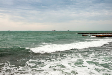 Dark sea and dark sky piers and 2 boats