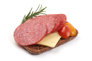 Slices of smoked salami with herbs and spices, isolated on white background