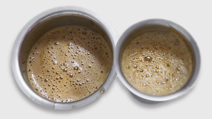 Indian filter coffee is famous coffee in steel cup.