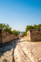 Old road through ruins of old town