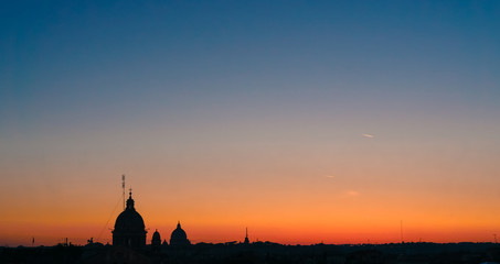 Dome silhouettes in Rome at sunset