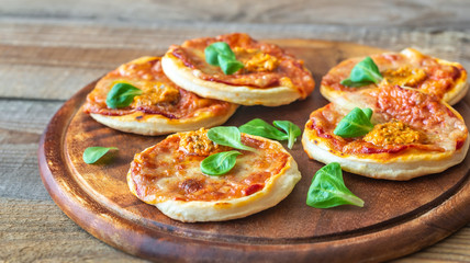 Mini pizzas on the wooden board