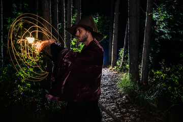 Man in a fantasy costume at halloween in forest