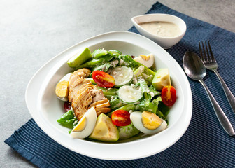 Fresh salad chicken breast with arugula and cherry tomatoes