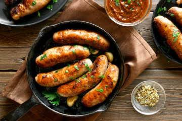Fototapeta Fried sausages in frying pan obraz