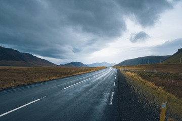 Mountain Iceland road in foggy, cloudy day. Backplate road. 