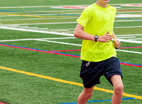 Young Runner In Neon Green Shirt