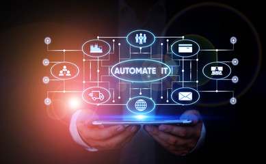 Writing note showing Automate It. Business concept for convert process or facility to be operated...