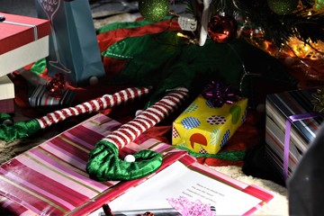 Leprechaun ornament legs under the Christmas tree