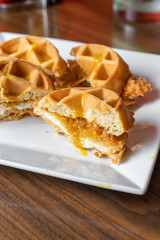 Chicken and waffle slider sandwiches. An inventive take on a Southern classic served for brunch.