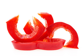 Red sweet bell pepper slices isolated on white background. Bulgarian pepper.