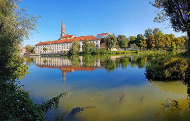 old town of landshut and isar river, with water reflection
