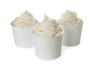 Cups with tasty frozen yogurt on white background